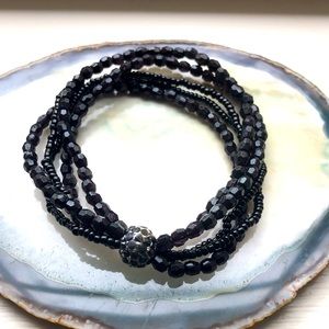 5-Strand Black Bead stretch bracelet with rhinestone accent ball